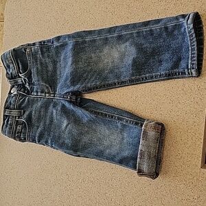Warm pattern lined straight leg jeans for toddler boys.  Medium wash